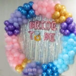 Balloon bachelorette decoration with balloon ring of pastel balloons, bride to be foil and 80 balloons on floor and wall
