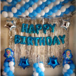 balloons happy birthday decoration with alphabets balloon set, frozen round foils, silver star-shaped foil balloons, frill curtains and blue and white balloons