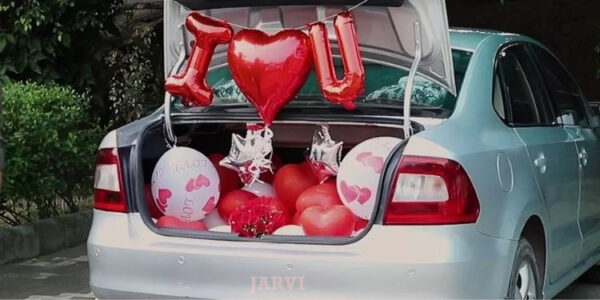 car decoration for proposal with One Heart Shaped Foil Balloon with Ribbons, Alphabet Balloons- I & U, 2 Star Shaped Foil, Printed Balloons and Bouquet of 10 Roses