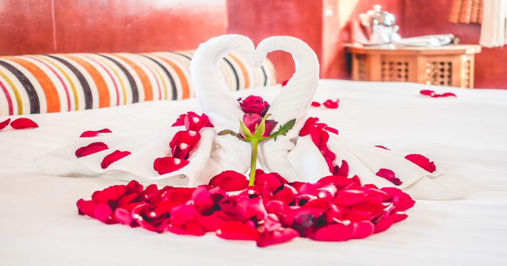 Swan towel and Rose flower decoration on bedroom interior with morocco style - vintage filter