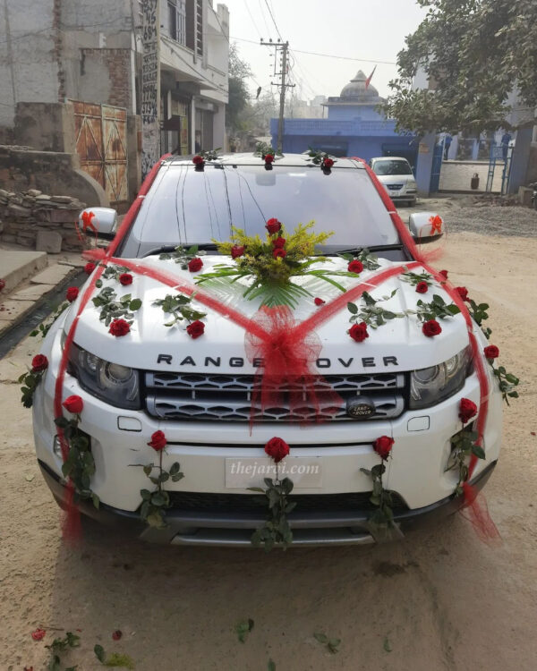 Marriage car decoration with bouquet, small bow and red roses